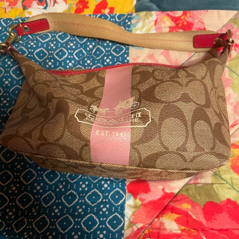 Authentic coach purse with coach and carriage logo